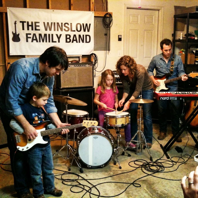 The family sets up their first proper home studio. Lucas picks up guitar. Sophie claims the drum kit.